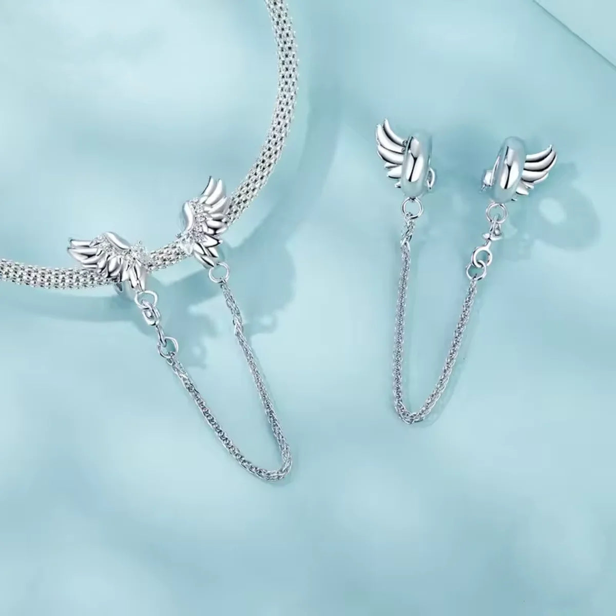 Keep your charm bracelet safe in heavenly style with this stunning Angel Winged Safety Chain. Adorned with shimmering cubic zirconia, each wing sparkles with grace and elegance.