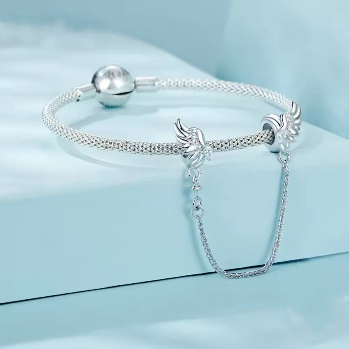 Keep your charm bracelet safe in heavenly style with this stunning Angel Winged Safety Chain. Adorned with shimmering cubic zirconia, each wing sparkles with grace and elegance.