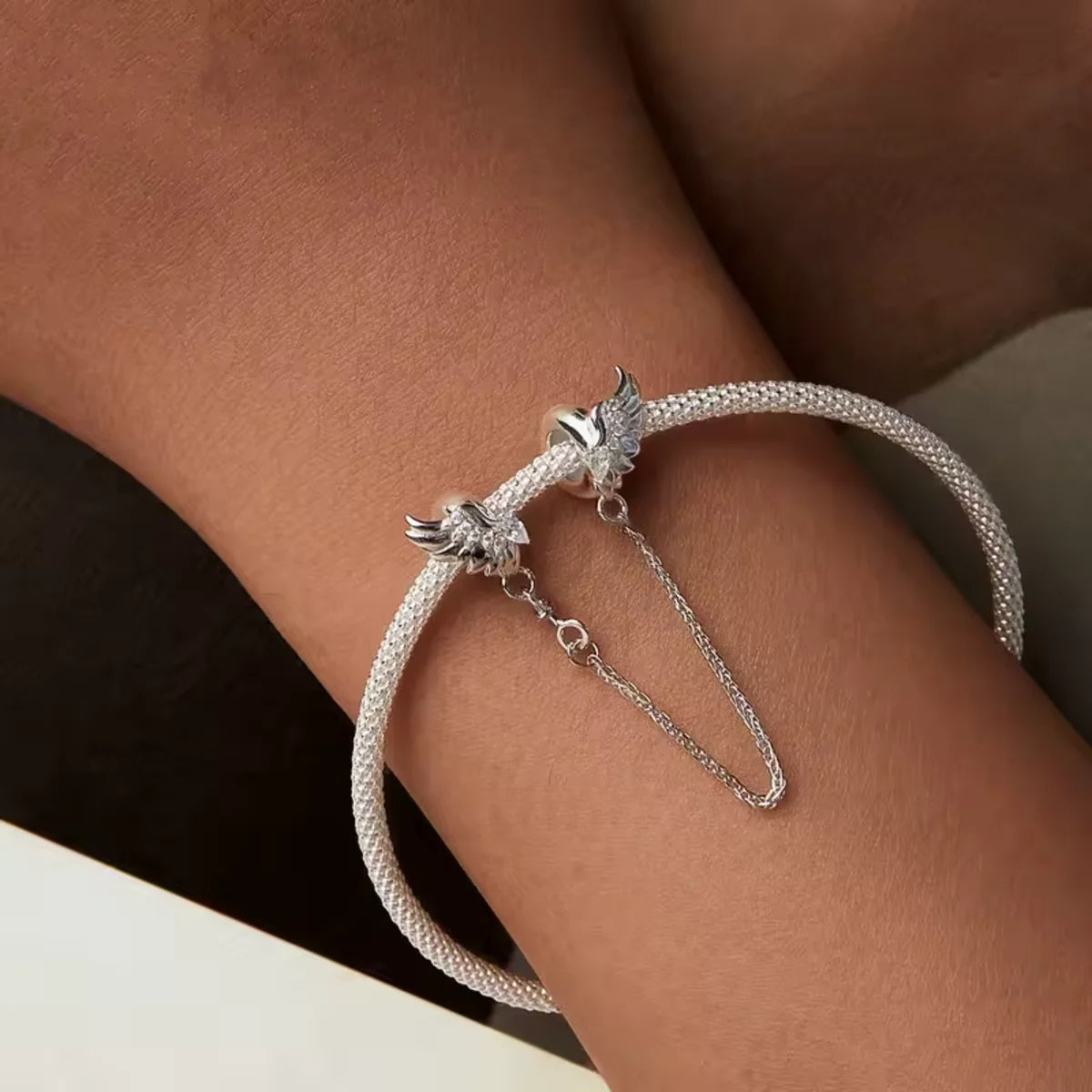 Keep your charm bracelet safe in heavenly style with this stunning Angel Winged Safety Chain. Adorned with shimmering cubic zirconia, each wing sparkles with grace and elegance.