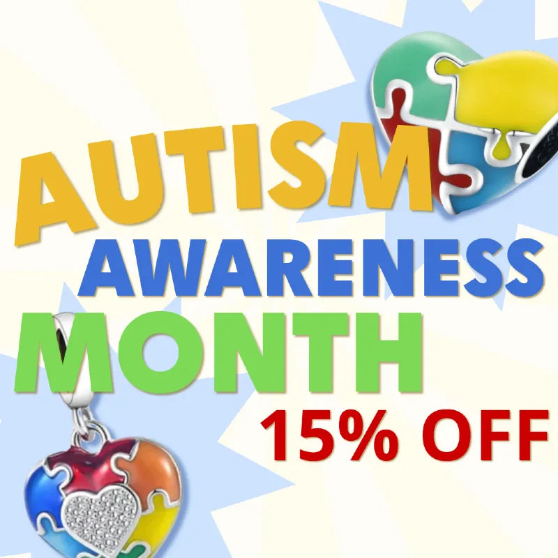Autism Awareness Month promotion with colorful text and a heart-shaped charm on a light blue background.