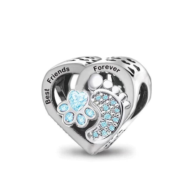 A heart-shaped silver charm with a pawprint and footprint design, accented with cubic zirconia, and the words 'Best Friends Forever' inscribed on the top.