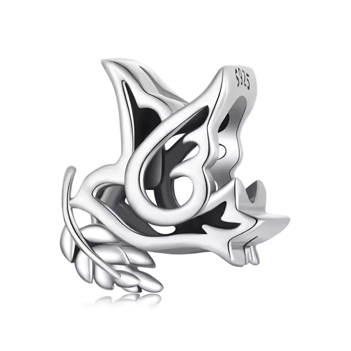 Silver charm with leaf and star design on a white background