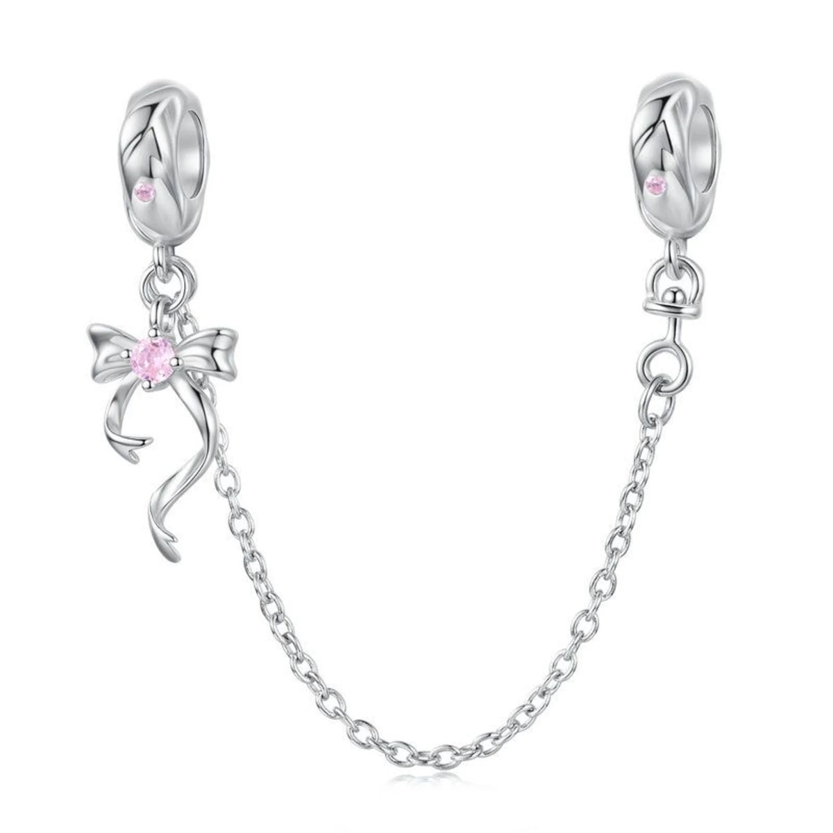 Silver charm with pink gemstones on a white background