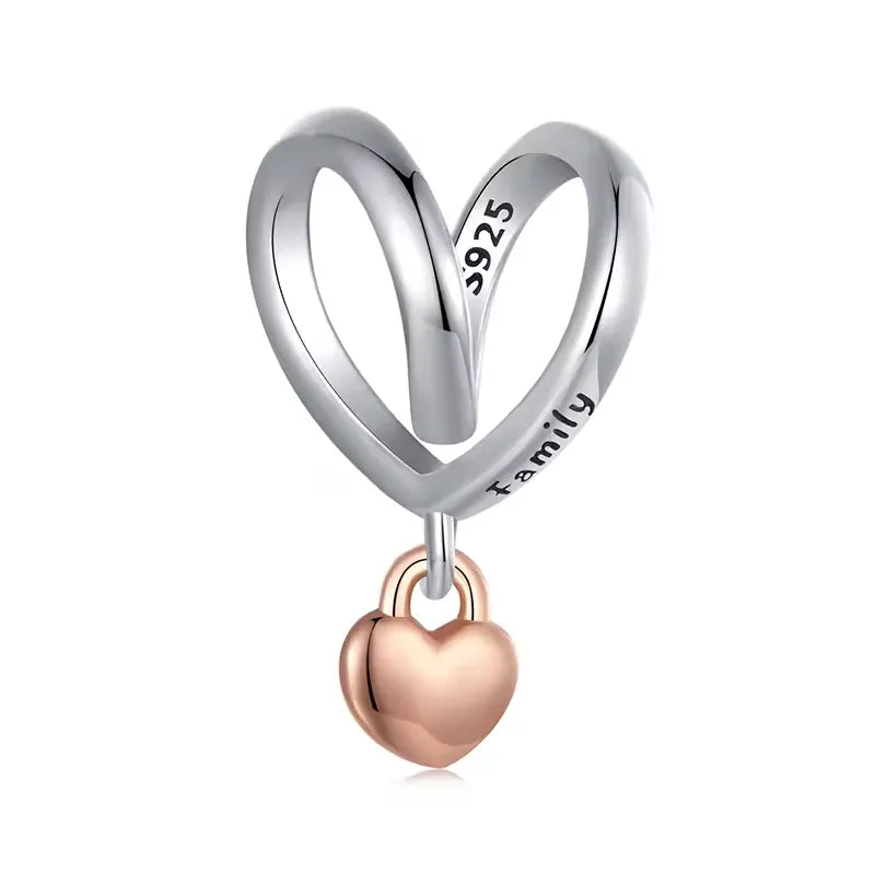 Elegant silver heart charm engraved with &#39;Family&#39; and a rose gold heart dangle, symbolizing family bonds.