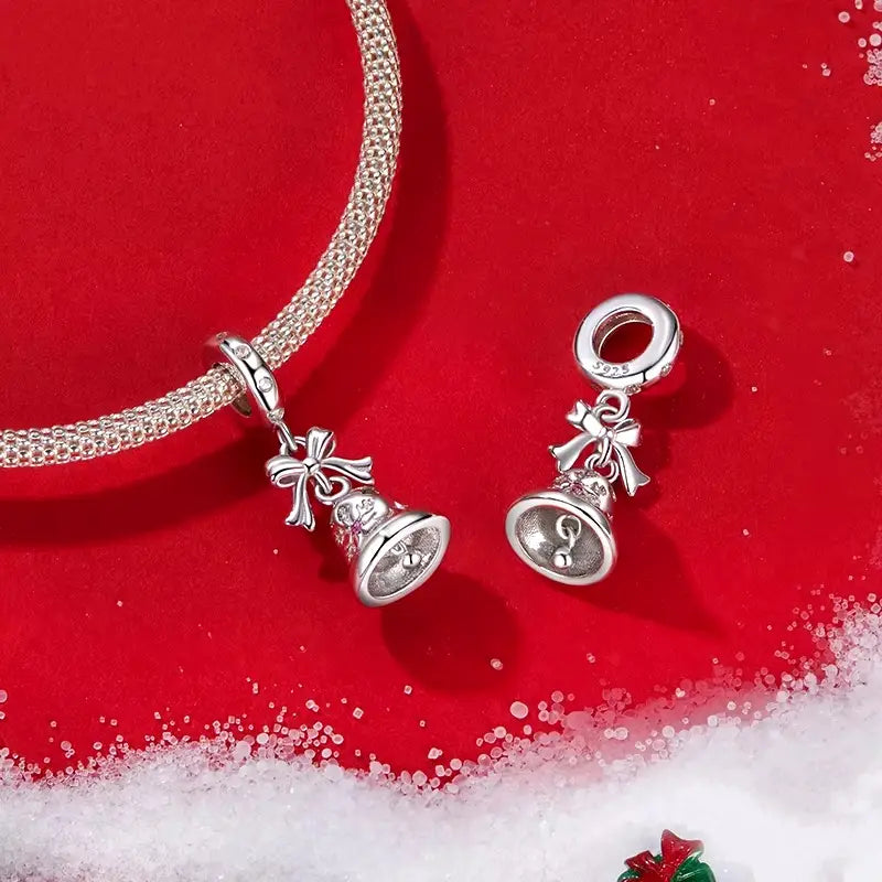 Celebrate the magic of the holiday season with our enchanting Christmas Bell Dangle Charm. This delightful charm features a beautifully detailed bell adorned with sparkling cubic zirconia that catches the light beautifully, adding a festive touch to any bracelet or necklace.