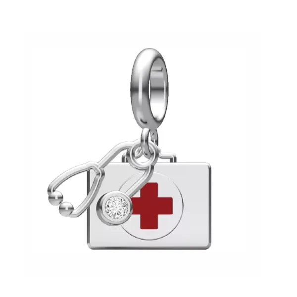 Carry a symbol of care and resilience with this beautifully crafted medical first aid kit dangle charm. Featuring a detailed stethoscope and a striking red cross design, this charm is a perfect tribute to healthcare professionals and medical enthusiasts. Made from sterling silver and accented with a dazzling clear cubic zirconia, it’s both stylish and meaningful.