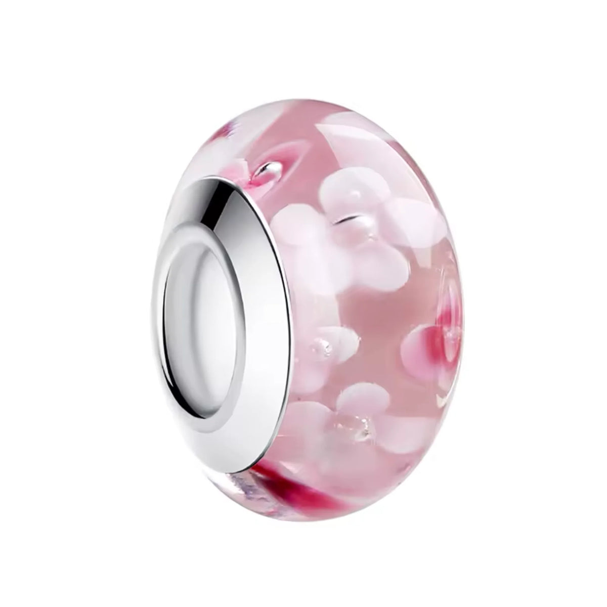 Glass charm with pink and white floral design on a white background