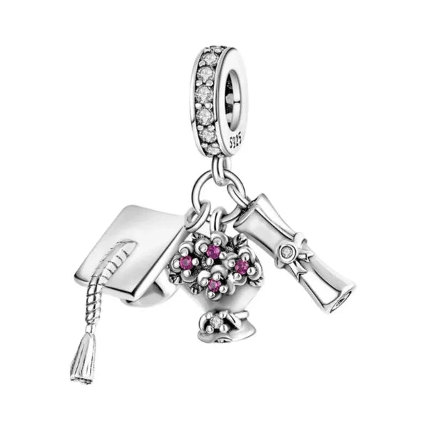 Graduation Celebration Dangle Charm with cubic zirconia, featuring a graduation cap, diploma, and floral bouquet.