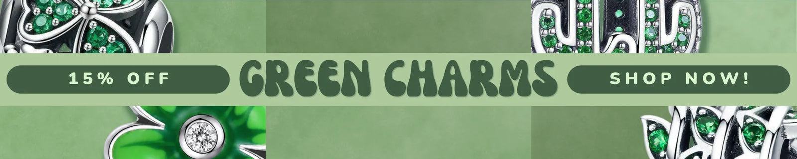 A promotional banner for 'Green Charms' featuring silver-toned jewelry with green stones, including a clover charm and a silver-toned ring, set against a green background with text reading '15% OFF', 'GREEN CHARMS', and 'SHOP NOW!'.
