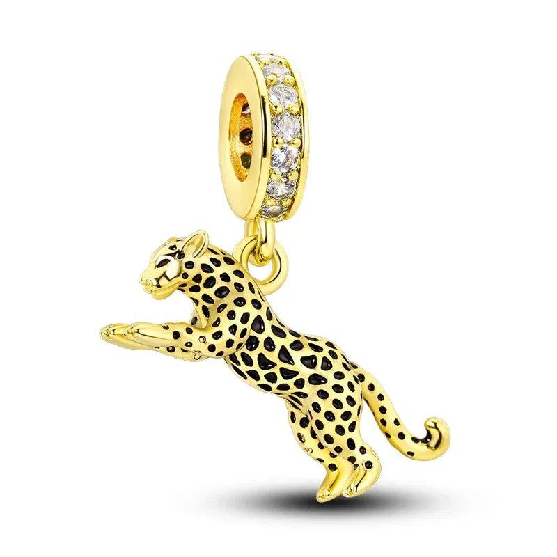 This exquisite Leopard Dangle Charm has been crafted with attention to detail, this charm features a sleek leopard design adorned with sparkling cubic zirconia accents and vibrant enamel detailing. The luxurious gold plating adds a touch of sophistication, making it a standout piece in your jewellery collection.