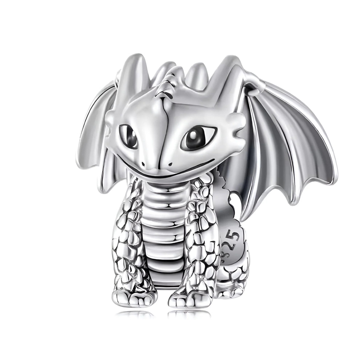 Silver dragon-shaped charm on a white background