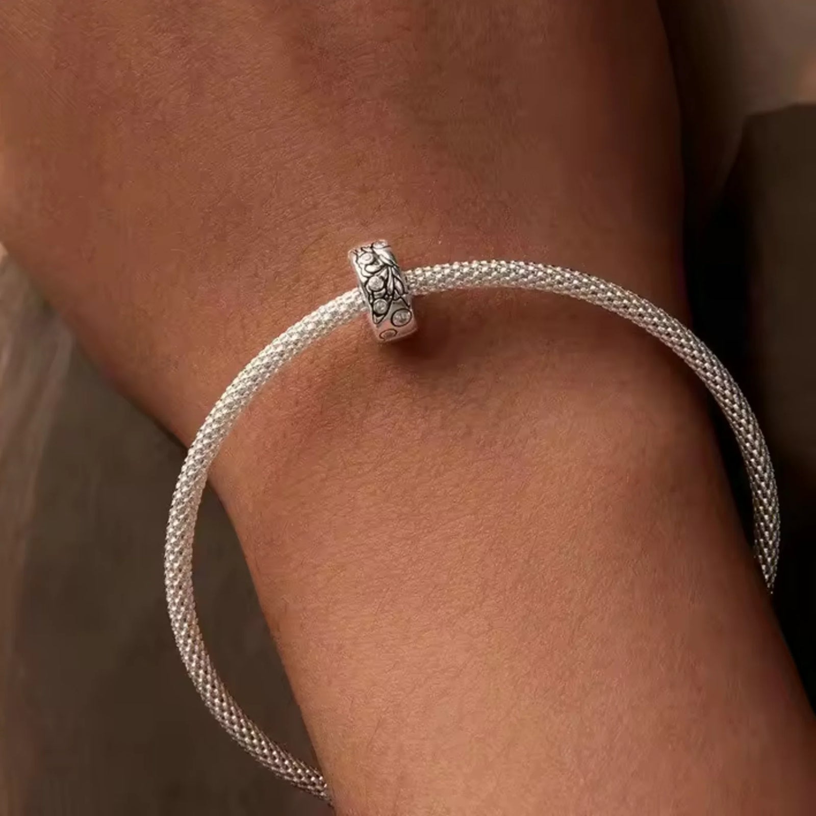 Silver clip charm with butterfly design and embedded cubic zircons 