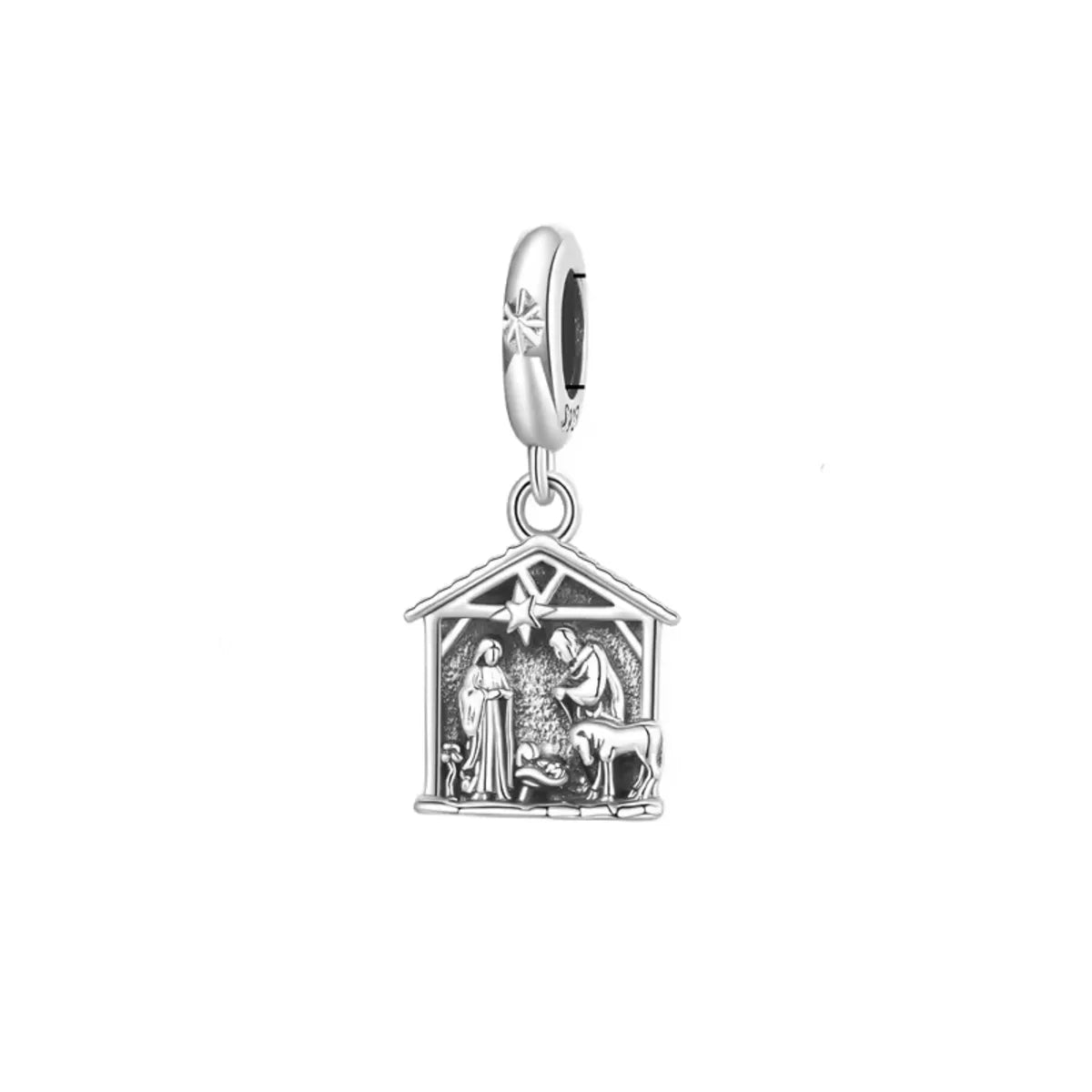 Silver nativity scene charm on a white background