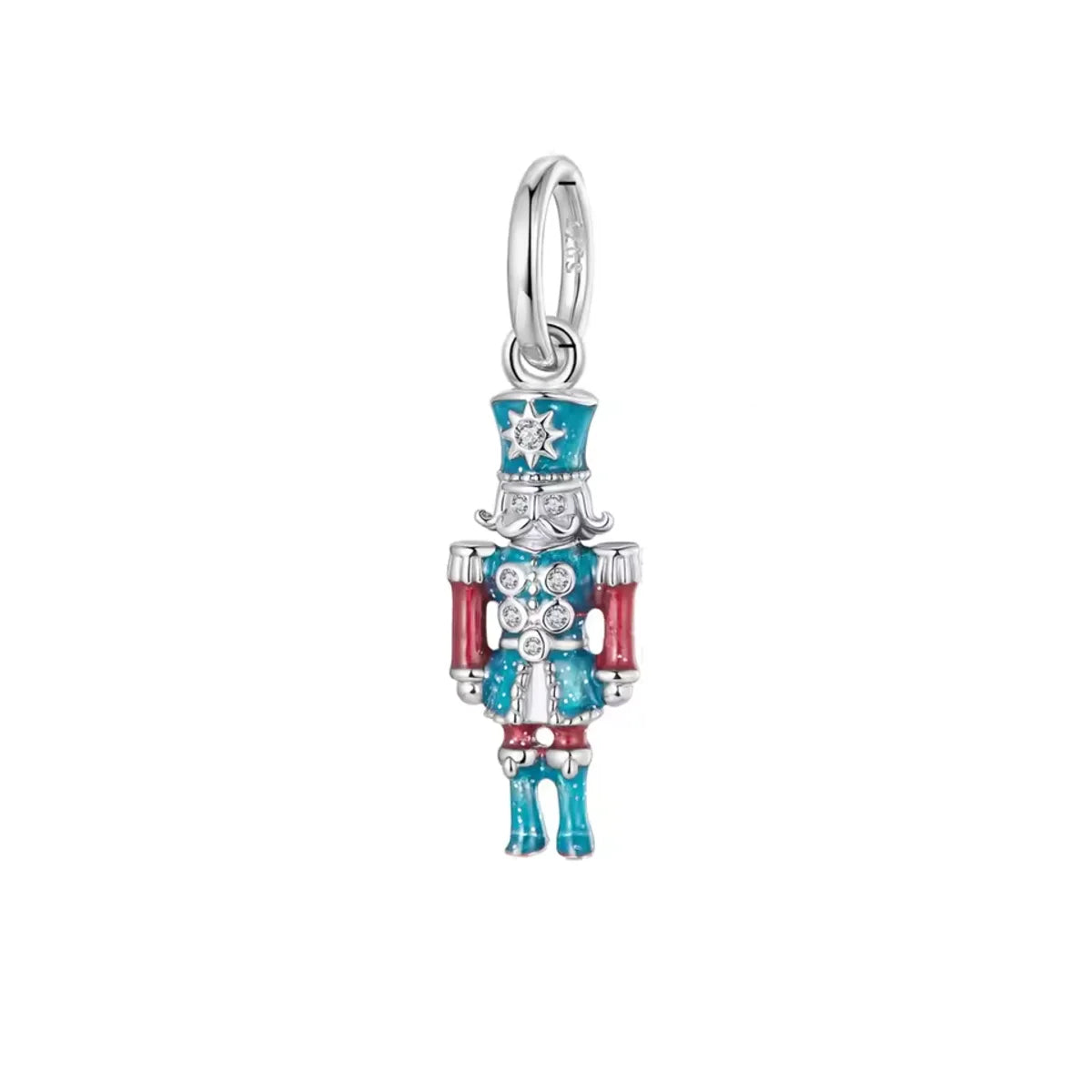 Silver charm shaped like a nutcracker with blue and red accents on a white background