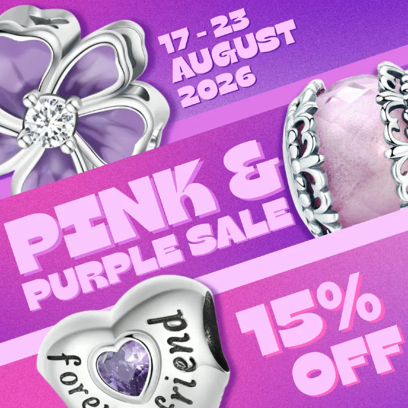 Promotional sale graphic for a jewelry store featuring pink and purple sale text, a 15% off discount, and partial views of silver-toned jewelry including a flower-shaped and a heart charm with a purple heart inset.