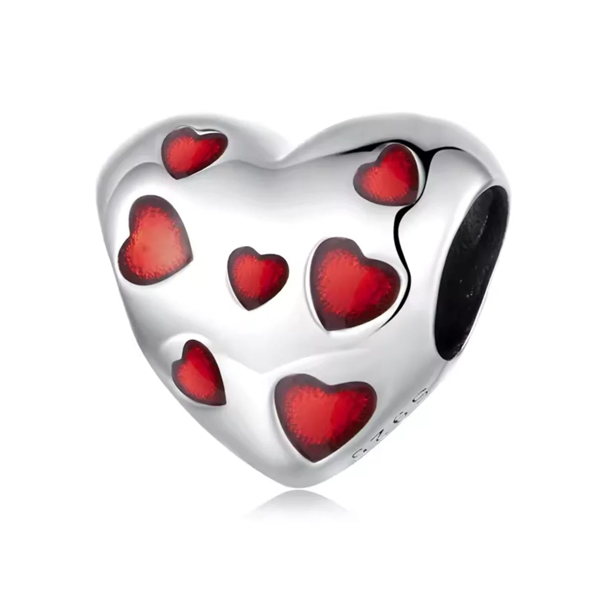 Fall head over heels with the Love-Filled Red Hearts Charm, a bold &amp; beautiful tribute to love in all its forms. This silver heart charm is sprinkled with rich red enamel hearts, each one full of passion and personality.