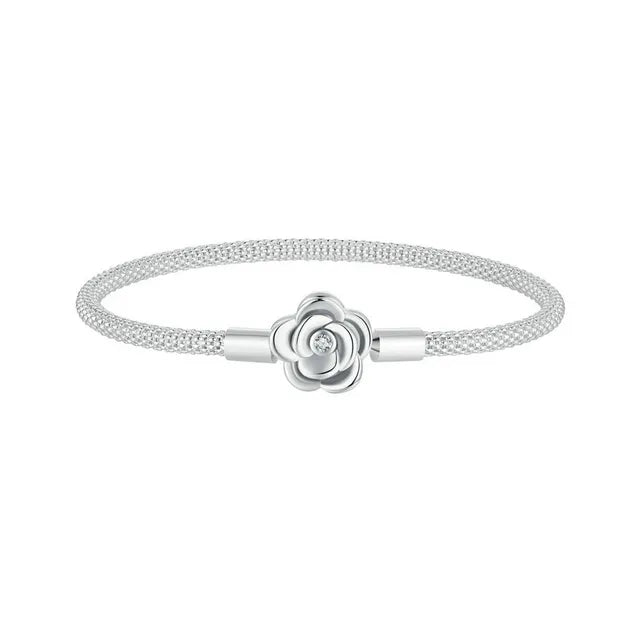 A silver bracelet with a rose-shaped clasp, featuring a cubic zirconia.