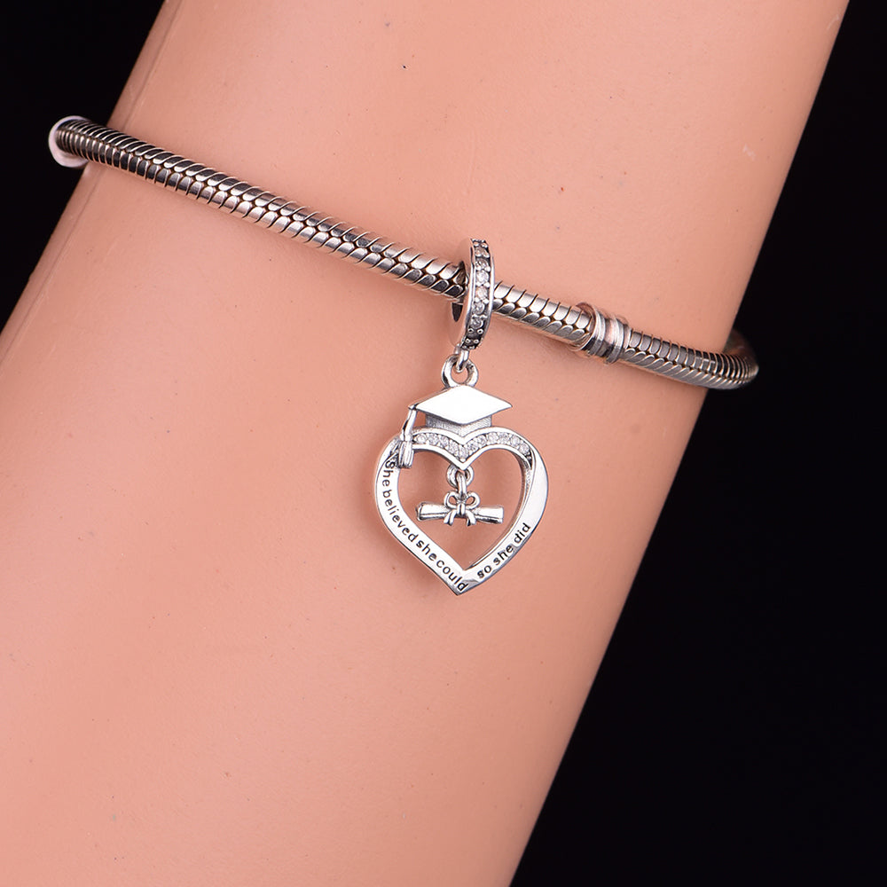 "She Believed She Could, So She Did" Graduation Heart Dangle Charm with CZ on silver bracelet