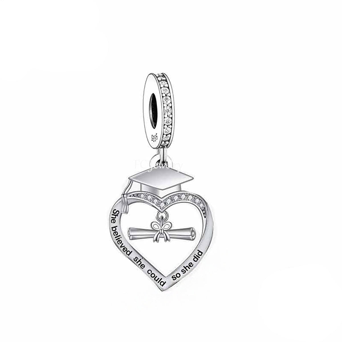 &quot;She Believed She Could, So She Did&quot; graduation heart dangle charm with cubic zirconia and sterling silver heart-shaped design.