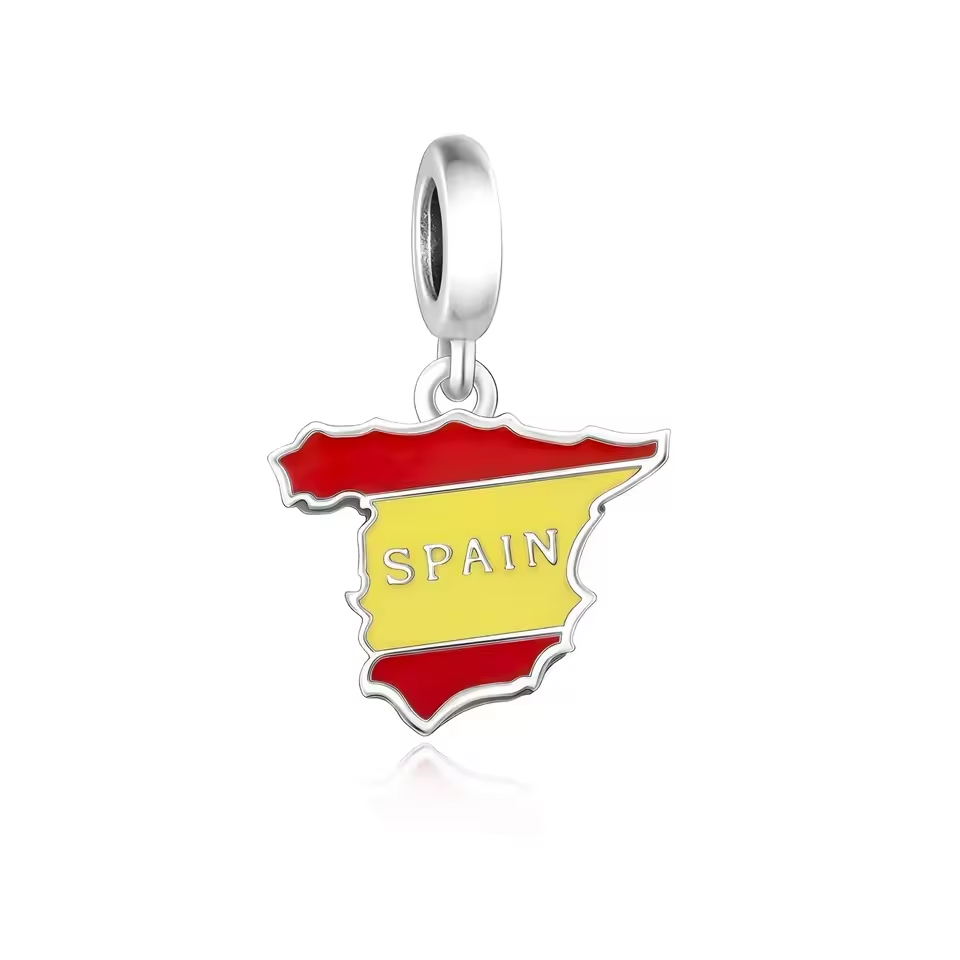 Viva España! Bring the warmth and vibrancy of Spain to your bracelet with this striking Spain flag dangle charm. Designed in the shape of the country and detailed with bright red and yellow enamel, this charm proudly displays “SPAIN” across the center for a bold and meaningful statement.