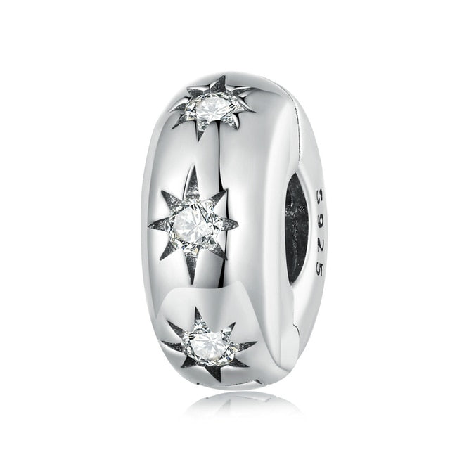 A sterling silver bracelet charm with a star-shaped design, featuring sparkling cubic zirconia embellishments.