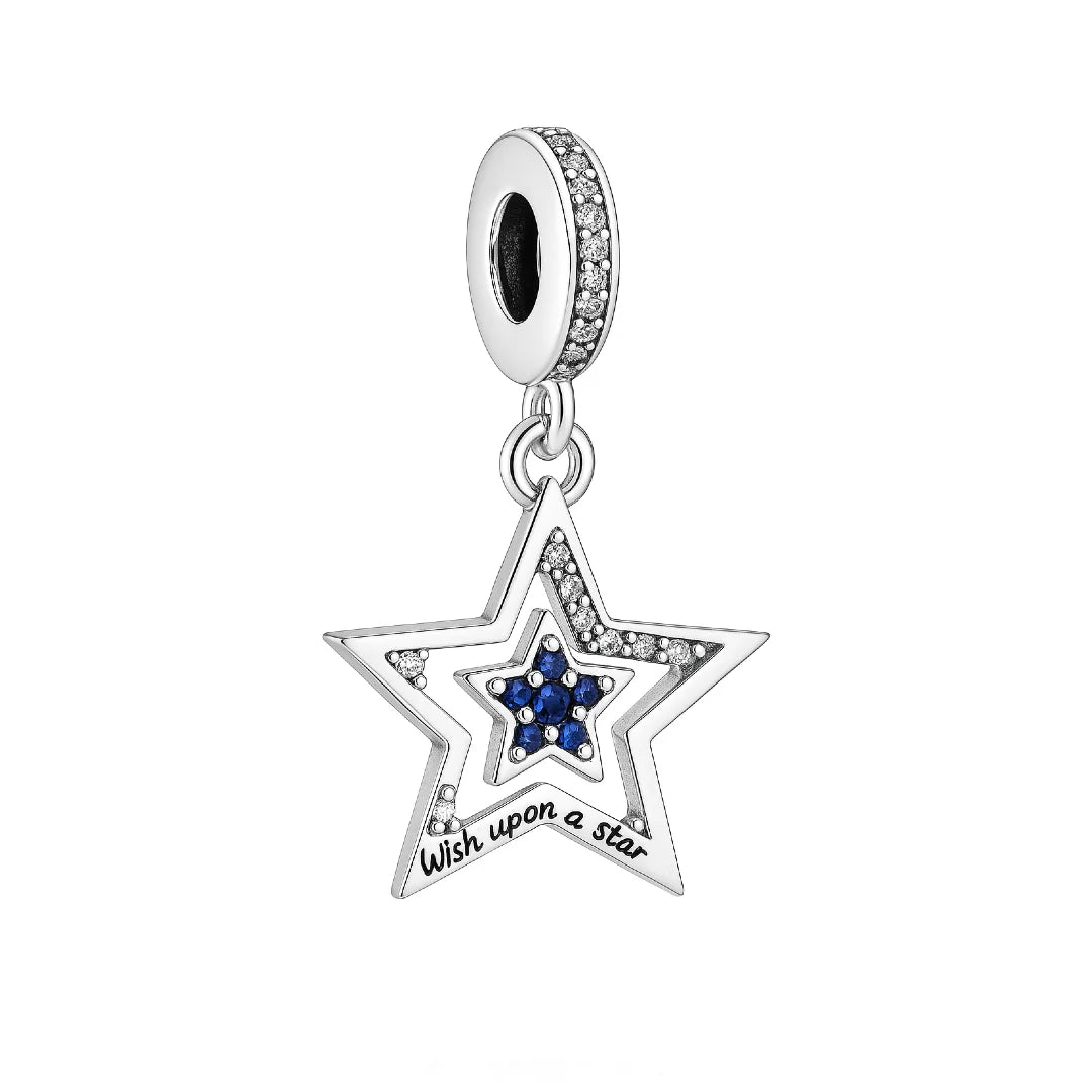 Make every day feel a little more magical with the Wish Upon a Star Dangle Charm! This stunning star-shaped piece features shimmering clear and deep blue cubic zirconia stones, capturing the wonder of a starlit night. The engraved message &quot;Wish upon a star&quot; adds a dreamy, hopeful touch that&#39;s perfect for women who love a little sparkle and a lot of meaning.