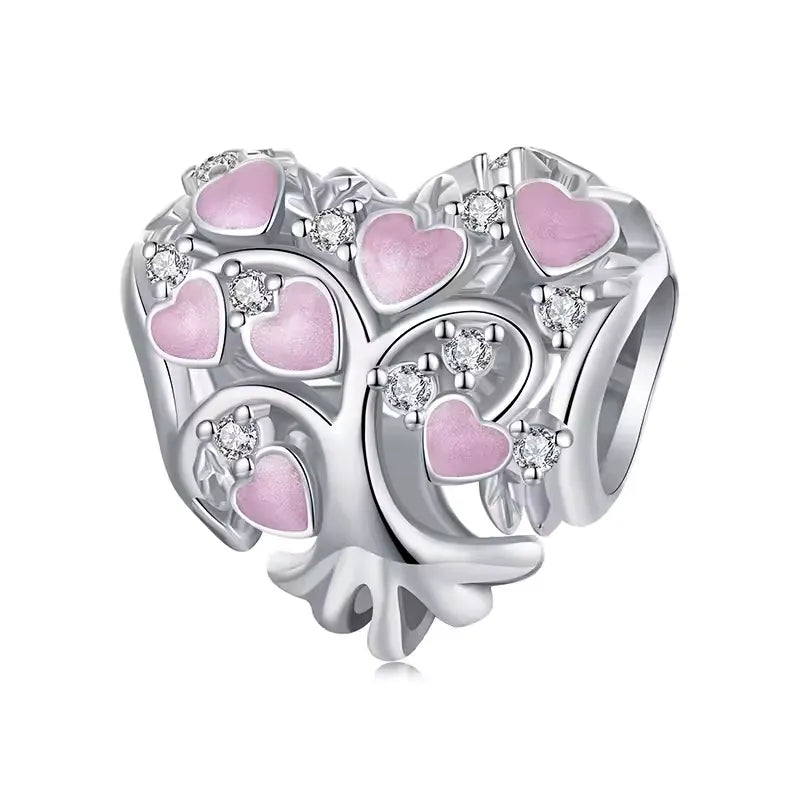Celebrate love, family, and growth with this stunning heart-shaped tree charm. Featuring delicate pink enamel hearts nestled among shimmering cubic zirconia accents, this charm symbolizes the branches of love that connect us all. Its intricate sterling silver craftsmanship highlights the natural beauty of the tree design, making it a heartfelt addition to any bracelet.