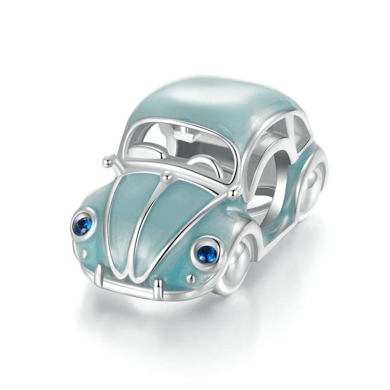 A silver charm in the shape of a vintage Volkswagen Beetle car with blue accents and blue crystal headlights.