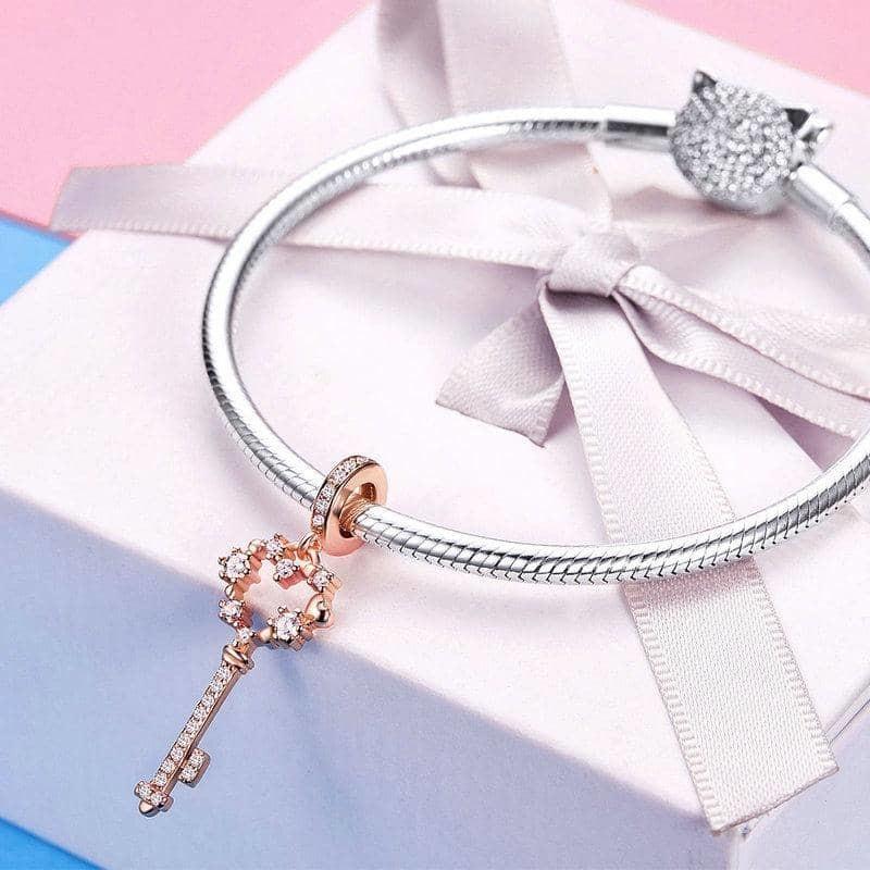 Celebrate your 21st birthday with this Sterling Silver 21st Key Dangle Charm. The intricate design and sparkling cubic zirconia stones make it a beautiful addition to any charm bracelet.
