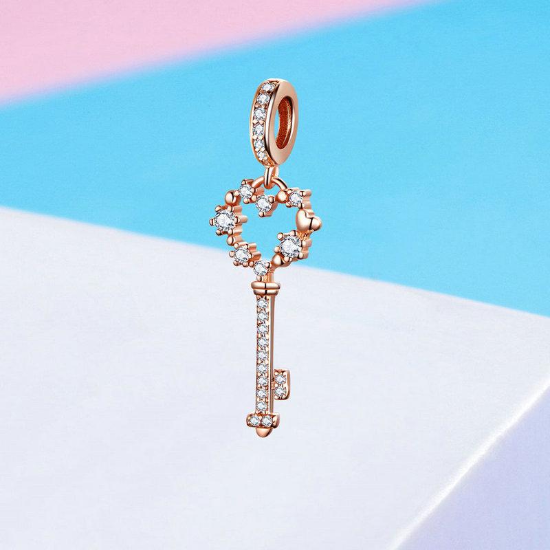 Celebrate your 21st birthday with this Sterling Silver 21st Key Dangle Charm. The intricate design and sparkling cubic zirconia stones make it a beautiful addition to any charm bracelet.