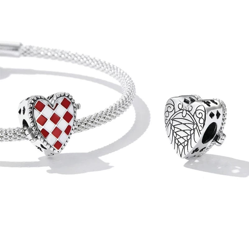 This Sterling Silver Alice In Wonderland Clock Charm is a quirky addition to any charm collection. Featuring a detailed clock design with an upside-down face, this charm is a fun way to show off your unique style. Compatible with Pandora bracelets and other popular charm bracelets, this charm is perfect for anyone who loves a touch of whimsy.