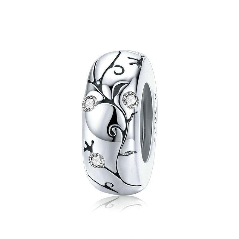 A sterling silver charm with a floral pattern and cubic zirconia embellishments.