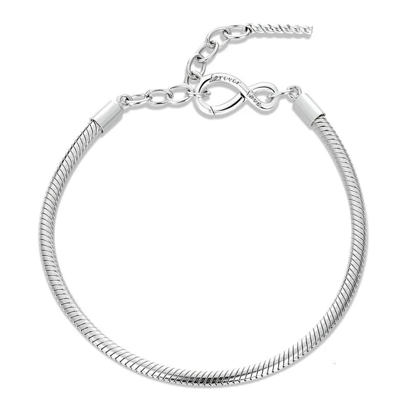 An adjustable sterling silver charm bracelet with an infinity symbol clasp, presented on a white background.