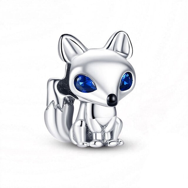 Get in touch with your wild side with this Sapphire Blue Eyed Foxy Charm. Featuring a beautifully designed fox with sparkling blue eyes and intricate detailing, this charm is perfect for anyone who loves a touch of nature. Compatible with Pandora bracelets and other popular charm bracelets, this foxy charm is sure to turn heads.