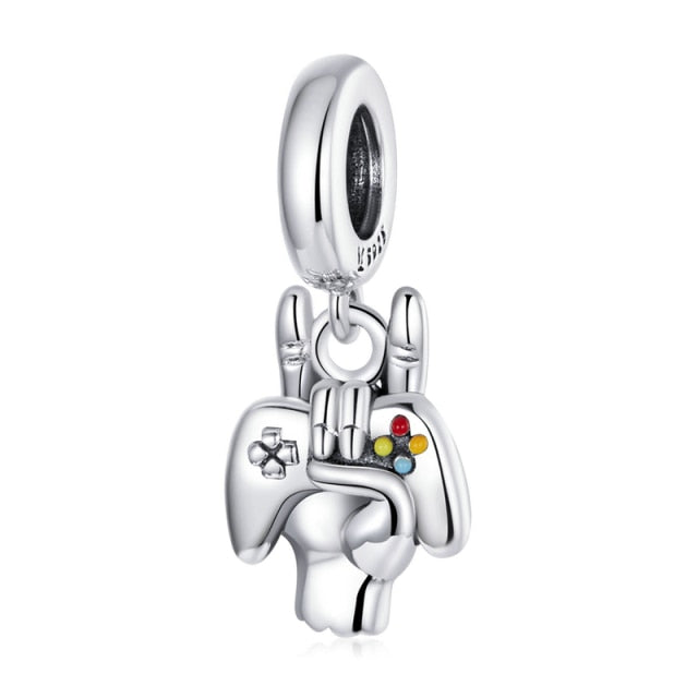 Showcase your love for gaming with our Gamer Dangle Charm. Made from Sterling Silver and featuring a playful design with a game controller, this charm is the perfect way to add some fun to your Pandora bracelet. With its intricate detailing and unique design, this charm is sure to be a hit with any gamer.