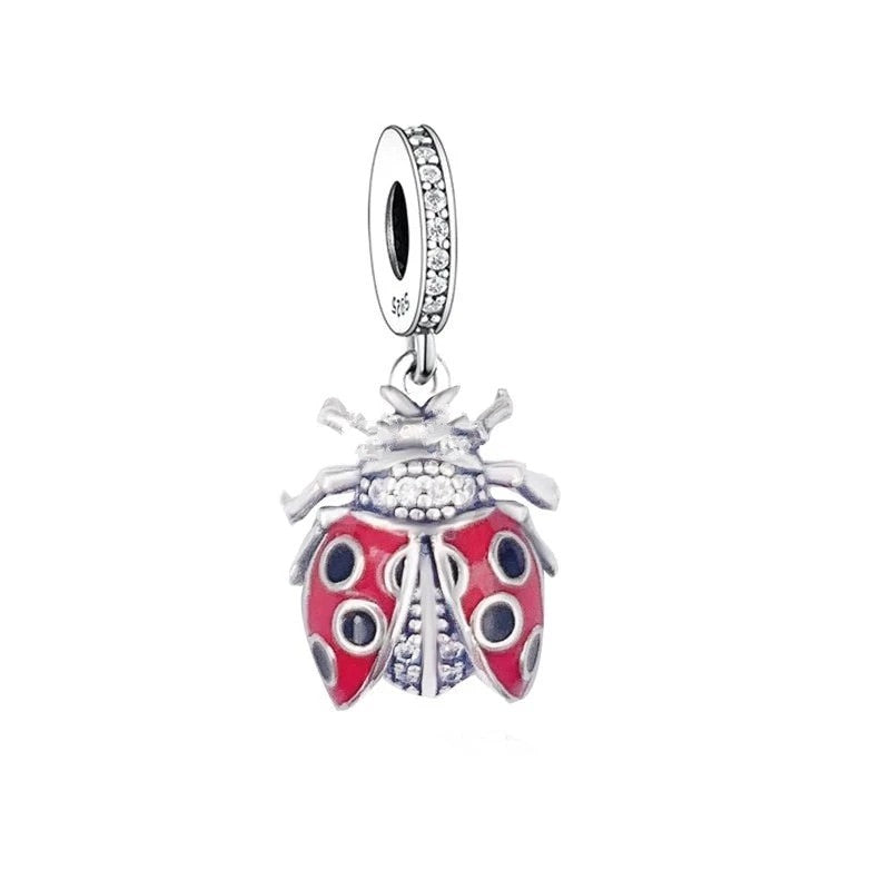 Add some luck and charm to your Pandora bracelet with our CZ Ladybug Dangle Charm. This Sterling Silver charm features a playful design with a ladybug accent and sparkling cubic zirconia stones that add a touch of glamour and shine to your bracelet. Perfect for anyone who loves all things cute and whimsical.
