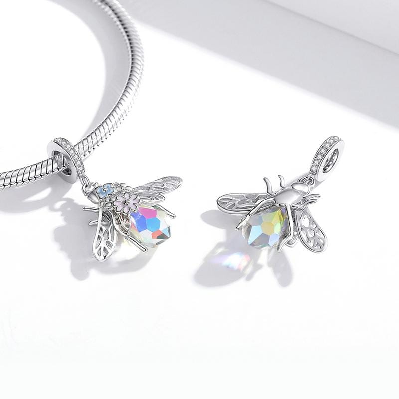 Add some buzz-worthy charm to your collection with the Opal Bee Dangle Charm. This beautifully designed charm features a bee with vibrant enamel and intricate details, compatible with Pandora and other popular charm bracelets. Whether you're a lover of all things nature or want to add a unique charm to your collection, this charm is a great choice.