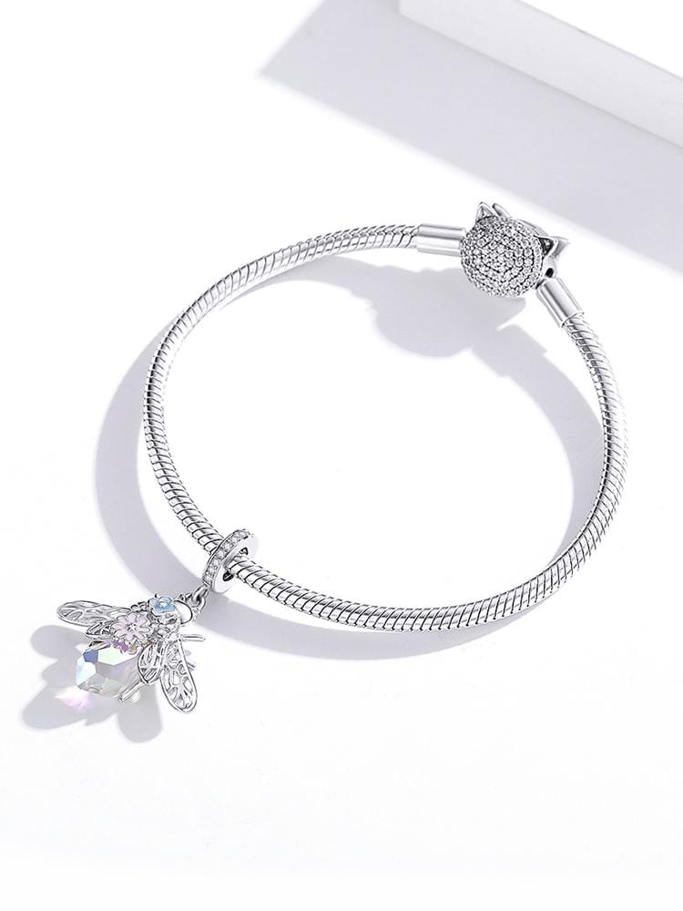 Add some buzz-worthy charm to your collection with the Opal Bee Dangle Charm. This beautifully designed charm features a bee with vibrant enamel and intricate details, compatible with Pandora and other popular charm bracelets. Whether you're a lover of all things nature or want to add a unique charm to your collection, this charm is a great choice.