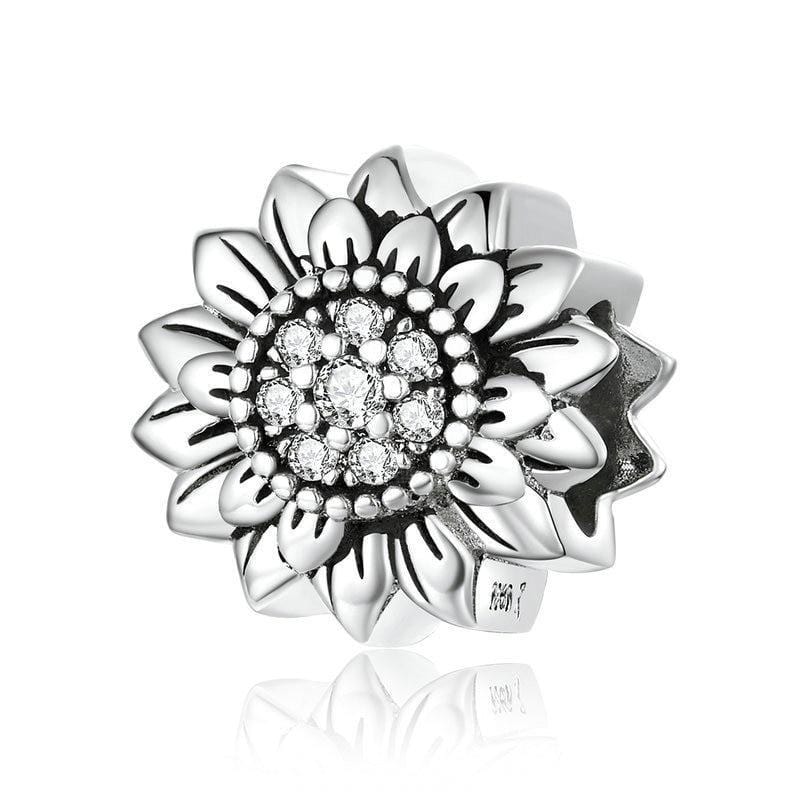 Brighten up your charm collection with this Sterling Silver Sunflower Charm. Featuring a detailed design with a lustrous center, this charm captures the beauty of this iconic flower. Compatible with Pandora bracelets and other popular charm bracelets, this sunflower charm is a beautiful addition to any collection.