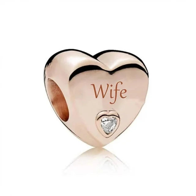 Sterling silver charm engraved with &quot;Wife&quot; featuring sparkling CZ stones in heart shape for Pandora bracelet.